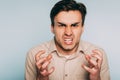 Anger rage hatred infuriated man baring teeth