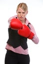 Anger woman employee in boxing gloves punching Royalty Free Stock Photo