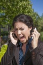 Anger woman shouting two phones Royalty Free Stock Photo