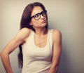 Anger young casual woman in glasses thinking and looking up. Vintage portrait