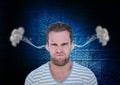 anger young man with steam on ears. Black and blue background