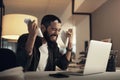 Anger is your own worst enemy. a young businessman feeling stressed while working late at night in a modern office. Royalty Free Stock Photo