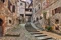 Anghiari, Arezzo, Tuscany, Italy: ancient narrow alley with staircase in the medieval village Royalty Free Stock Photo