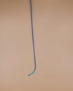 Angioplasty guiding catheter used to treat blockage in the arteries of heart . Image isolated on beige background