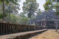 A stone causeway supported by many finely carved columns provides an impressive entrance to the Baphuon temple mountain