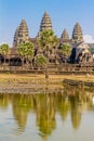 Angkor Wat across the lake, reflected in water Royalty Free Stock Photo