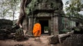 Angkor Wat monk. Ta Prom Khmer ancient Buddhist temple in jungle Royalty Free Stock Photo