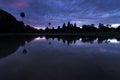 Angkor Wat reflected in the lake at sunrise, view of popular tourist attraction ancient temple in Siem Reap, Cambodia Royalty Free Stock Photo