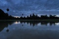 Angkor Wat reflected in the lake at sunrise, view of tourist attraction ancient temple in Siem Reap, Cambodia Royalty Free Stock Photo