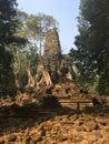 Angkor Wat in Siem Reap, Cambodia. Ancient ruins of Preah Palilay Khmer stone temple overgrown with the roots and giant trees Royalty Free Stock Photo
