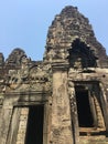 Angkor Wat in Siem Reap, Cambodia. Stone faces carved in the ancient ruins of Bayon Khmer Temple Royalty Free Stock Photo