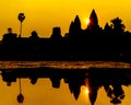 Angkor Wat at sunrise across the lake, reflected in water Royalty Free Stock Photo