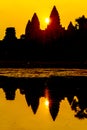 Angkor Wat at sunrise across the lake, reflected in water Royalty Free Stock Photo