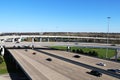 An angle aerial view looking at a busy freeway interstate exchange from above with multiple lanes of freeway traffic below Royalty Free Stock Photo