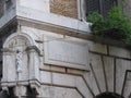  Niche with a stylized statue of the Virgin with Jesus child to Rome in Italy.