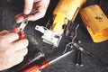 Angle Grinder Repair, Technician Replacing the Power Cord on wooden desk