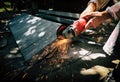 Angle grinder sparks angle grinder cutting steel. A worker cutting steel in concrete sheet with grinder.