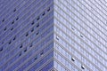 Angle modern business building skyscraper blue glass and aluminum, white square. Windows of facade.