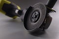 Angle pneumatic grinders grinder with a disc on a gray background Royalty Free Stock Photo