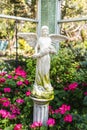 Angle sculpture in spring garden, decorate item Royalty Free Stock Photo