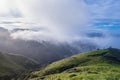 Angle view of a beautiful rural landscape with green pastures and mountains full of tropical vegetation in the middle of a sunny