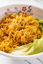 angle view bowl of noodles with cabbage vertical composition