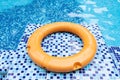 Buoy on the edge of an outside swimming pool horizontal composition Royalty Free Stock Photo