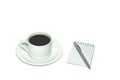 An angle view of a cup of black coffee, saucer, and side notepad with pen, on an all-white background. Royalty Free Stock Photo