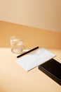Angle view of envelope, pen, glass Royalty Free Stock Photo