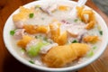angle view fish slices and pork porridge with deep-fried Chinese donuts horizontal composition Royalty Free Stock Photo