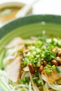 Guilin rice noodles with bowl of soup nearby vertical composition Royalty Free Stock Photo