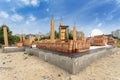 Angle view rows of new red brick wall lies on foundation of house under construction. Residential building with height marks Royalty Free Stock Photo