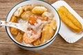 seafood porridge with crabs and shrimps and white shells and deep-fried dough sticks horizontal composition Royalty Free Stock Photo