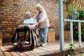 Angle view of senior disabled man sitting in wheelchair near wife Royalty Free Stock Photo