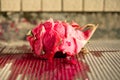 angle view smashed red-fleshed dragon fruit on the ground Royalty Free Stock Photo