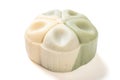trendy and beautiful flower shape green and white colors moon cake on a white background