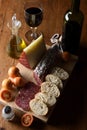 Angle view  typical spanish food,tomato,wine,bread, cheese, sausage and olive oil on a wooden table Royalty Free Stock Photo