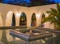 Angled blue and white tiled fountain at dusk in Morocco Royalty Free Stock Photo