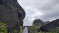 Angled plank trail near rock overhang