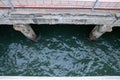 Angled view down at concrete dock area undergoing repair