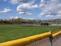 Angled view of a large, empty baseball field on a bright, sunny day Royalty Free Stock Photo