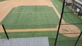 Angled view of a large, empty baseball field on an overcast day Royalty Free Stock Photo