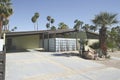 Angled View of Modern Home in Palm Springs with Pitched Roof and Front Patio