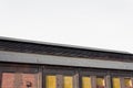 Angled view of old industrial building, windows covered in yellow fiberglass Royalty Free Stock Photo