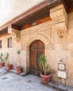 Stone bricks wall with arched wooden door of house of Moustafa Gaafar Al Selehdar, Cairo, Egypt Royalty Free Stock Photo