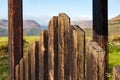 Pointed Top Of Grungy Old Wooden Gate With Picturesque Landscape In Background Royalty Free Stock Photo