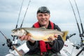 Angler with arctic char Royalty Free Stock Photo