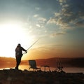 Angler carp angler on the lake with fishing rods Royalty Free Stock Photo