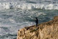 Angler at a cliff and rock Royalty Free Stock Photo