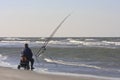 Angler upon dutch beach in Nes, Ameland Island Royalty Free Stock Photo